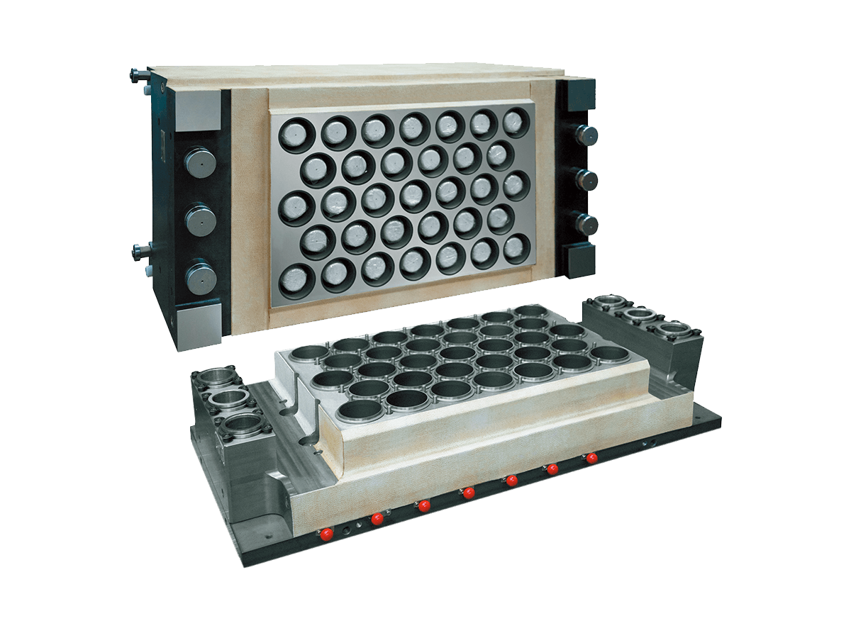 A picture of a tilting thermoforming mold with in-mold cutting for high-speed plastic cup production